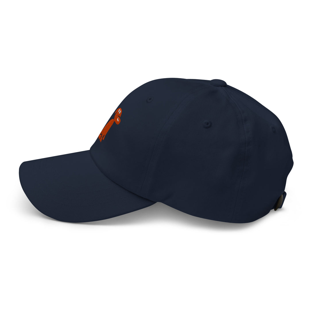 Navy blue cap with a small orange dog logo on a white background