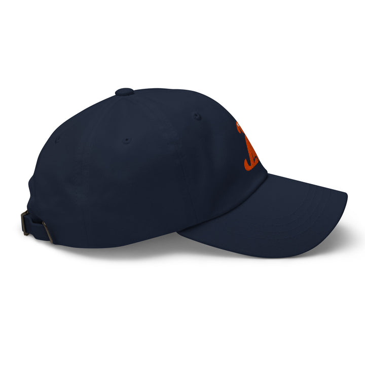 Navy blue cap with a small orange dog logo on a white background
