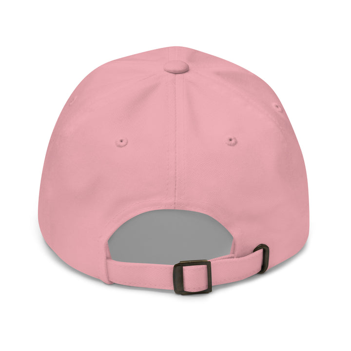 Pink baseball cap with gray interior and black strap on a white background