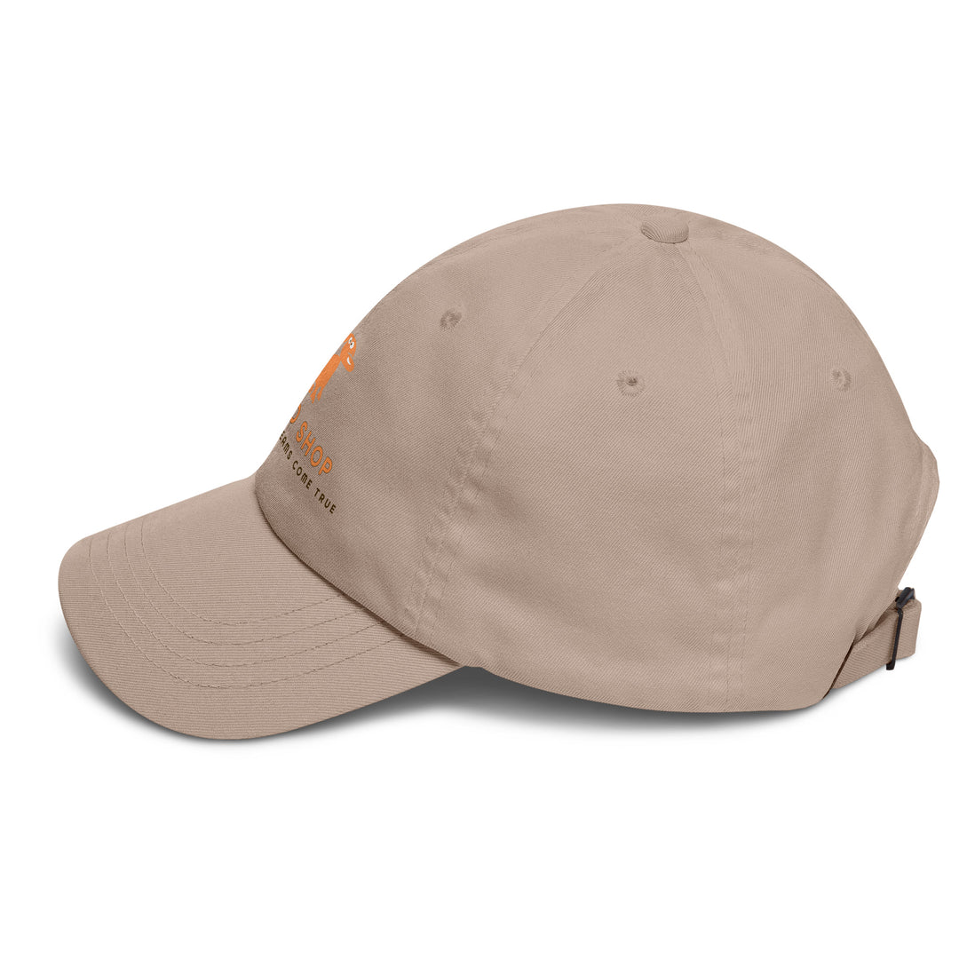 Beige baseball cap with doggo shop logo on a white background