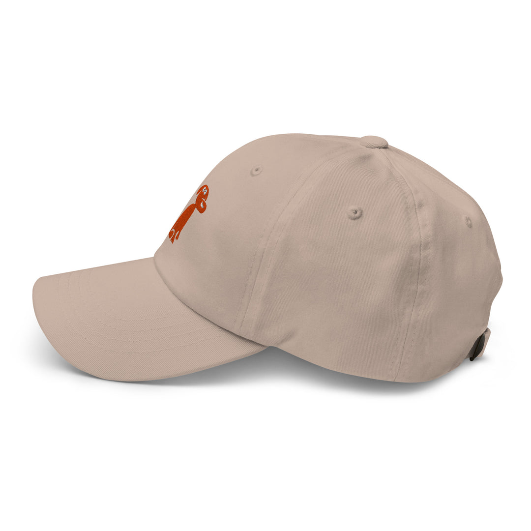 Beige cap with a dog logo on a white background
