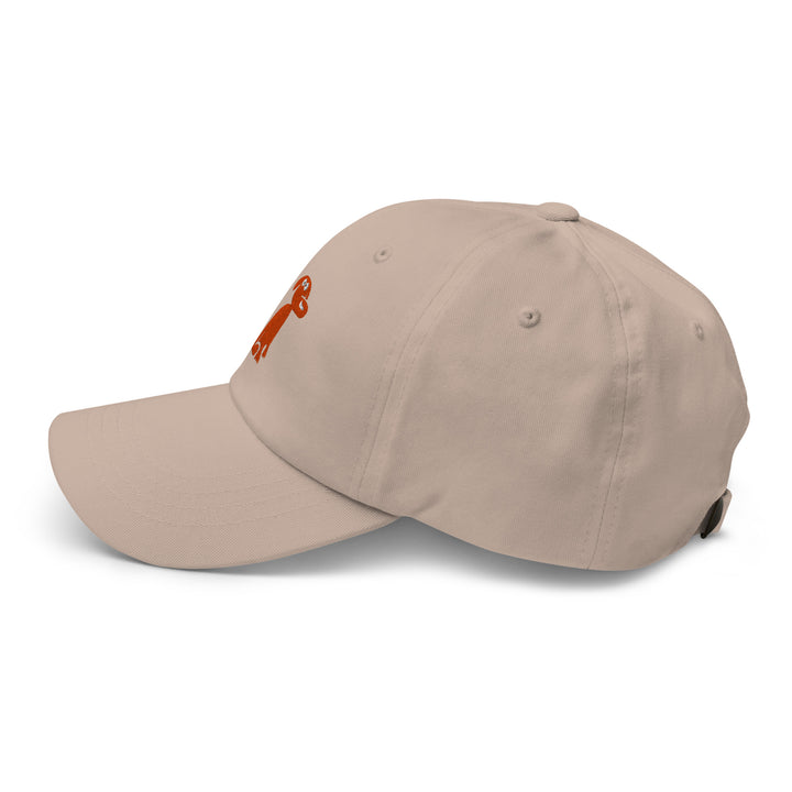 Beige cap with a dog logo on a white background