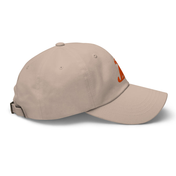 Beige baseball cap with a logo on the side against a white background