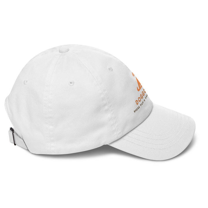 White cap with doggo shop logo print on a white background