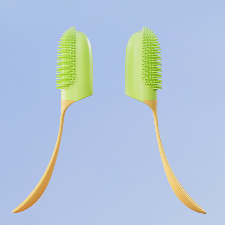 Two green and yellow toothbrushes on a light blue background
