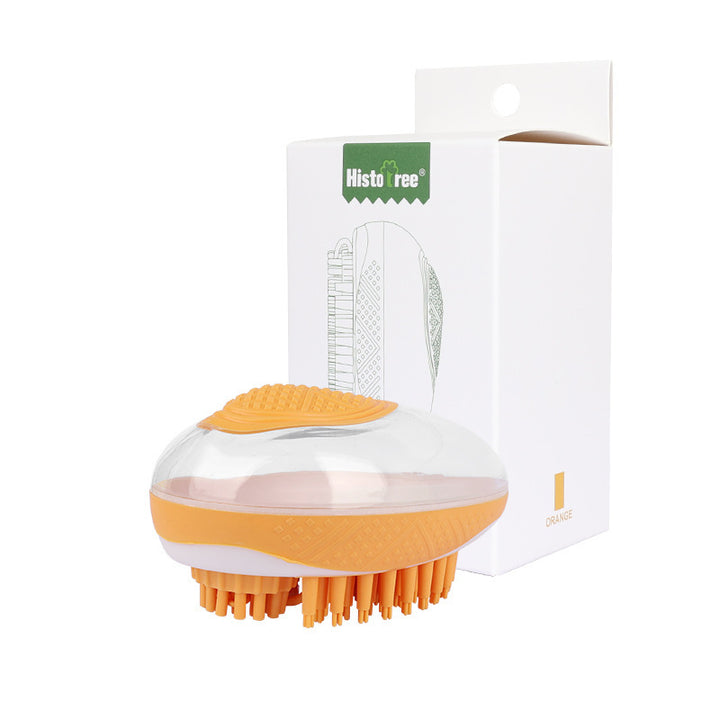 Orange and white grooming brush with packaging on a white background