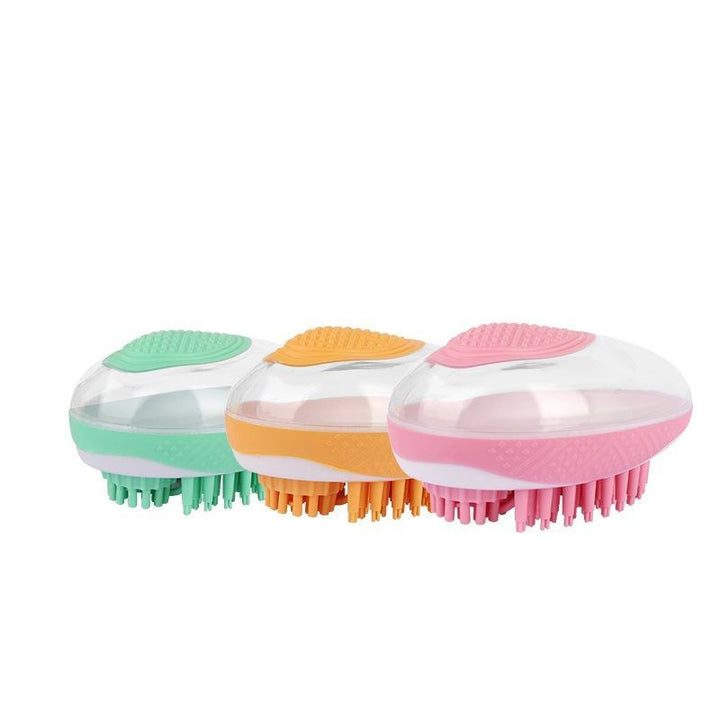 Three colorful scalp massagers on a white background