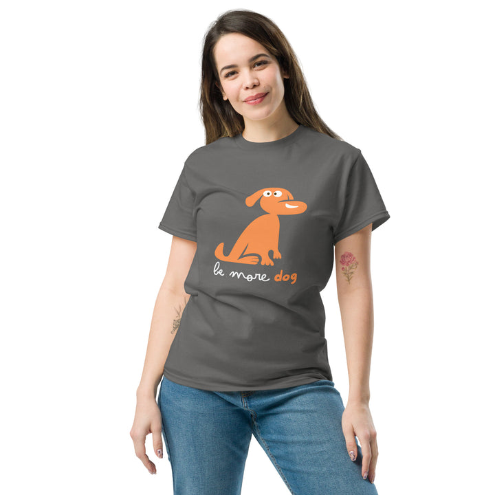 Woman wearing a gray t-shirt with an orange dog graphic and text on a white background