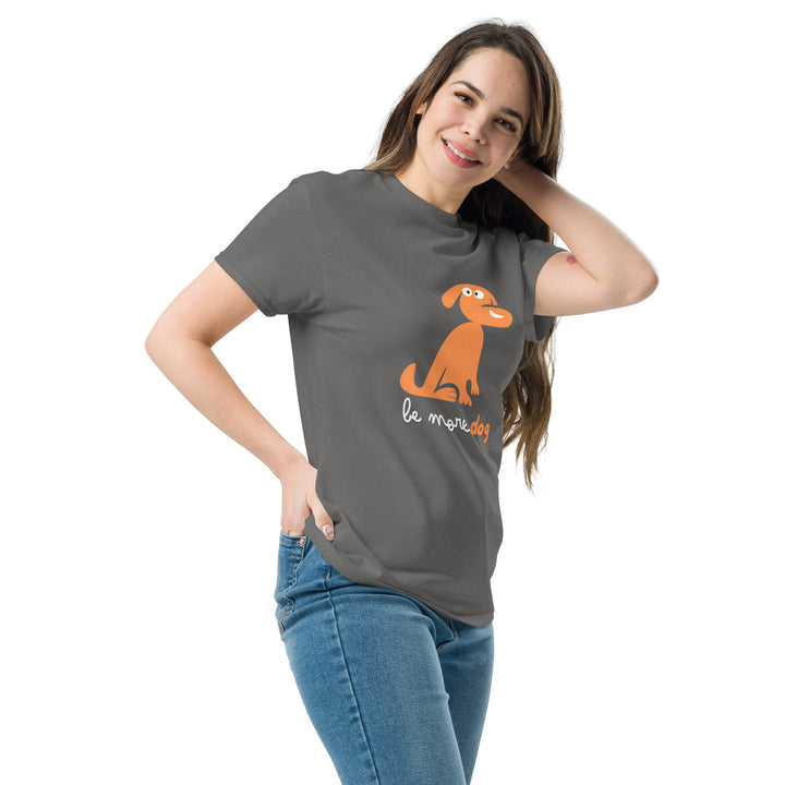 Woman wearing a gray t-shirt with an orange dog graphic and text on a white background