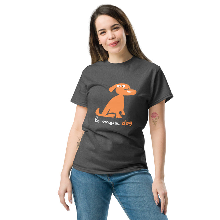 Woman wearing a dark gray t-shirt with an orange dog graphic and text on a white background