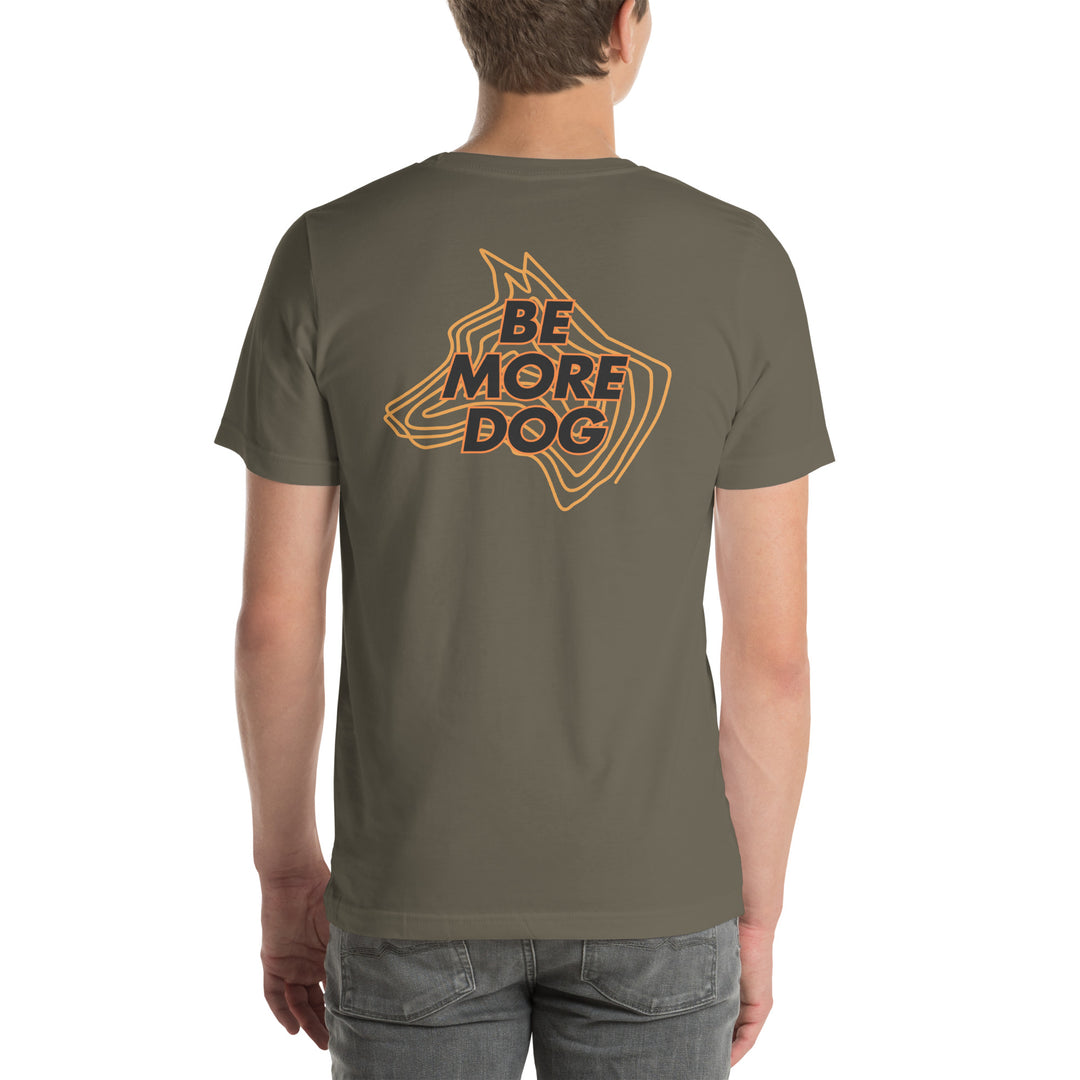 Person wearing a brown t-shirt with 'Be More Dog' graphic on the back
