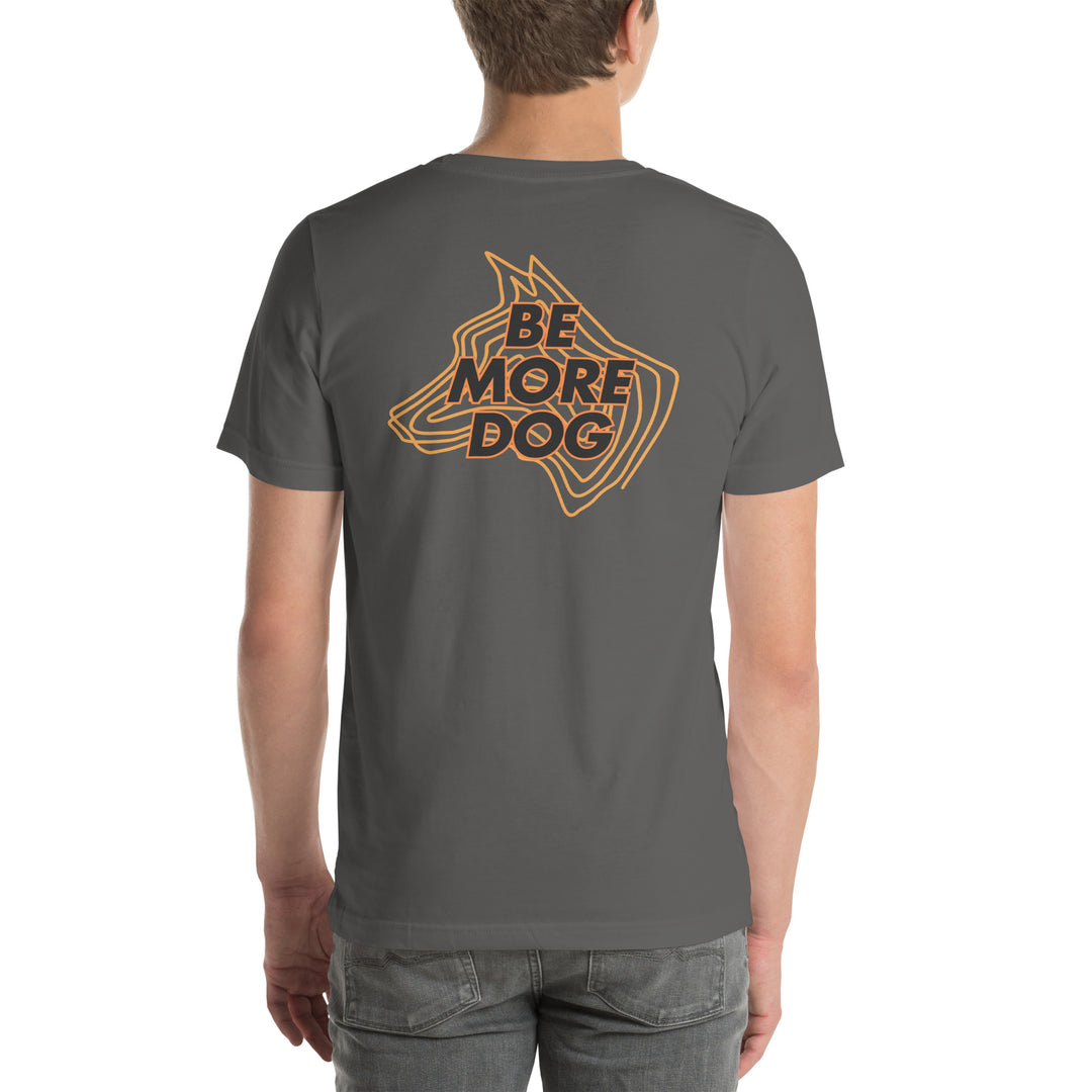 Person wearing a gray t-shirt with 'Be More Dog' graphic on the back