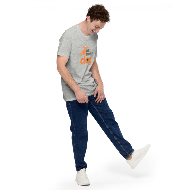 Person wearing a gray t-shirt with orange text, blue jeans, and white sneakers on a white background