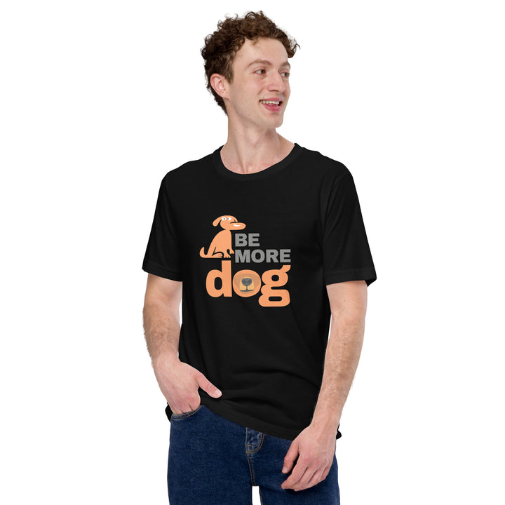 Person wearing a black t-shirt with 'Be More Dog' text and graphic on a white background