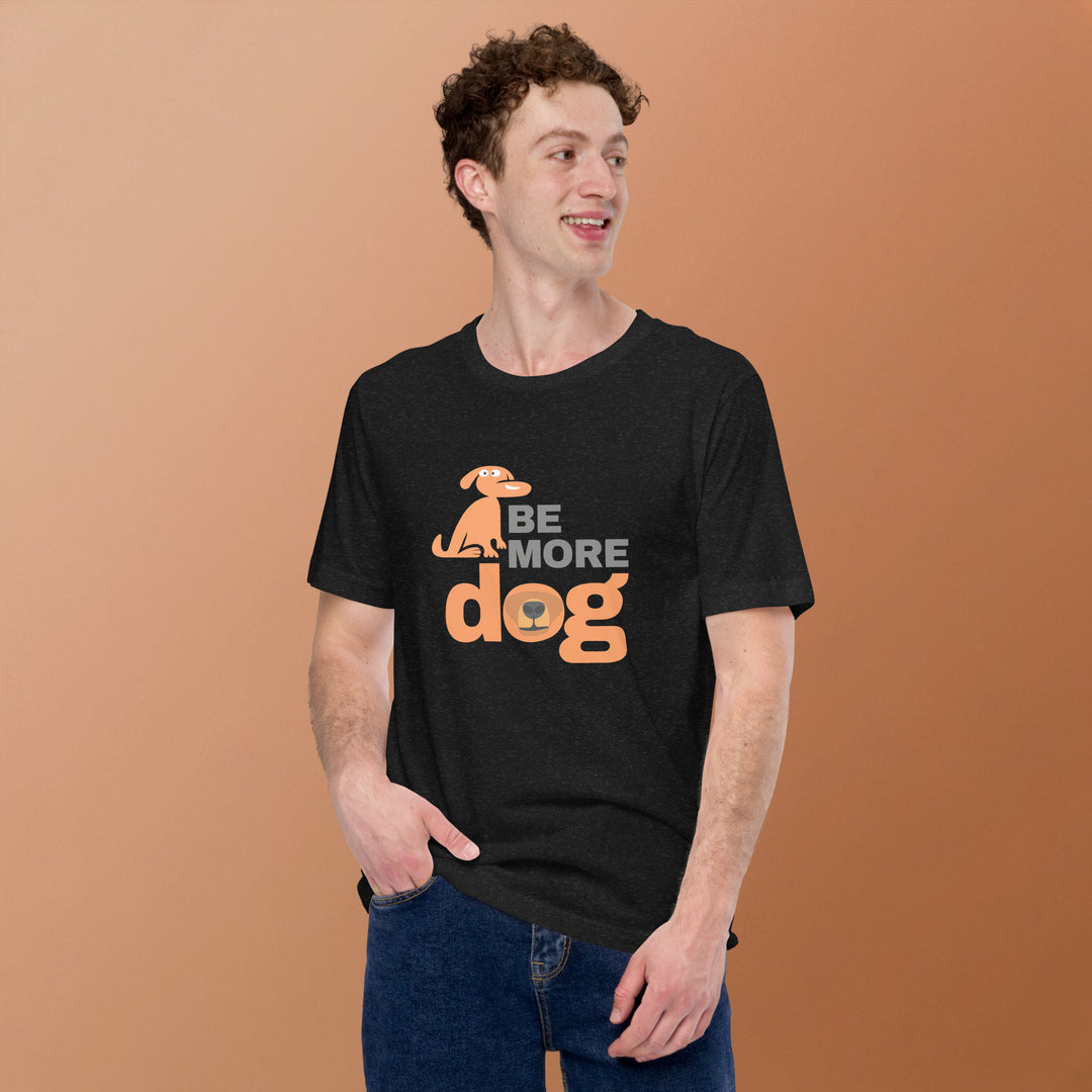 Person wearing a black t-shirt with 'Be More Dog' text and graphic on orange background
