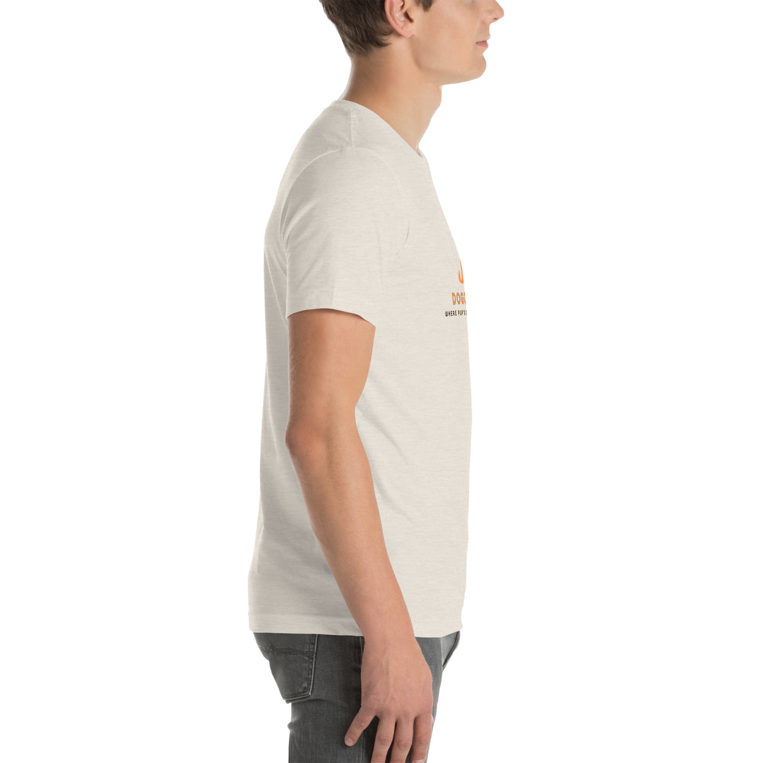Person wearing a light-colored t-shirt with a logo on a white background
