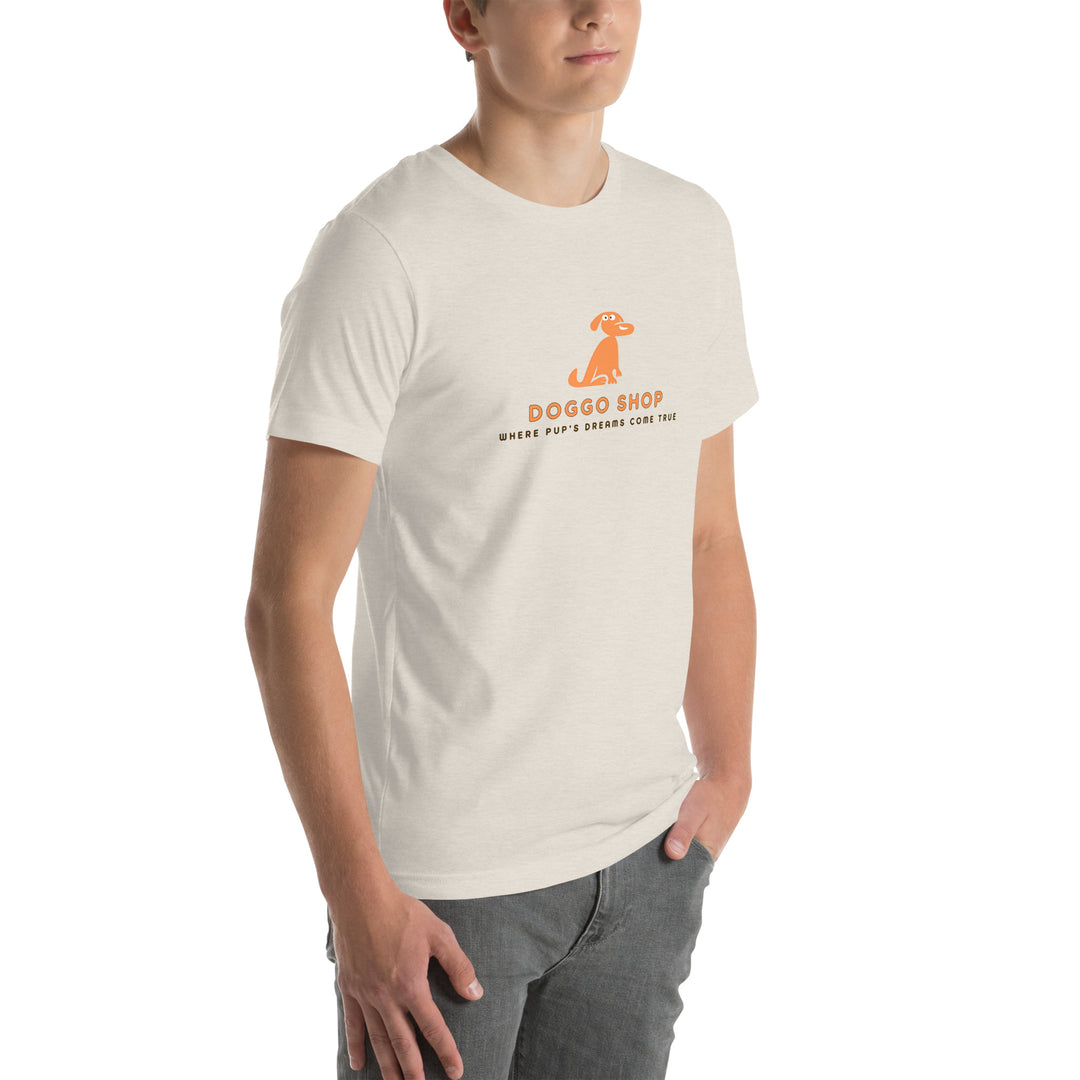 Person wearing a dust colored t-shirt with doggo shop logo print on a white background