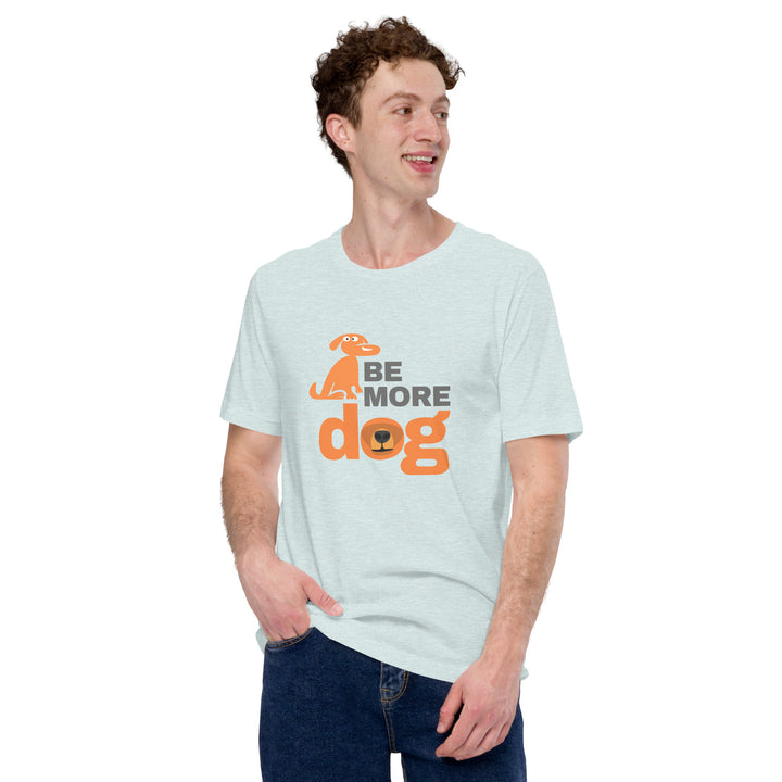 Man wearing a light blue t-shirt with 'Be More Dog' text and graphic on a white background