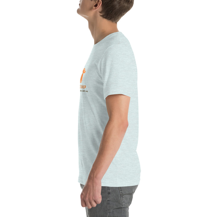 Person wearing a light blue t-shirt with a logo on the chest against a white background