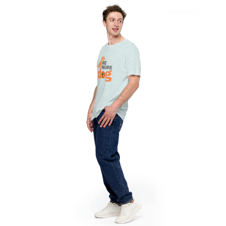 Man wearing a light blue t-shirt with text and dark jeans on a white background