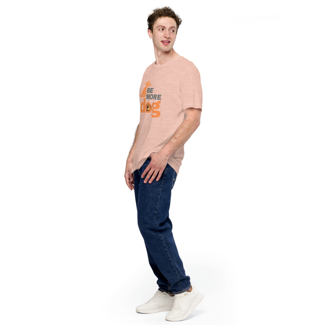 Man wearing a light pink t-shirt with text and dark blue jeans on a white background