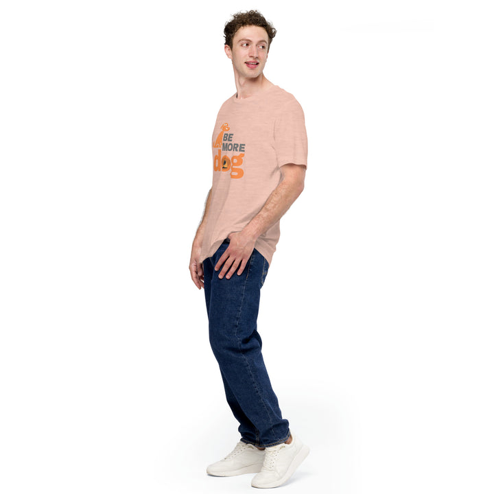 Man wearing a light pink t-shirt with text and dark blue jeans on a white background
